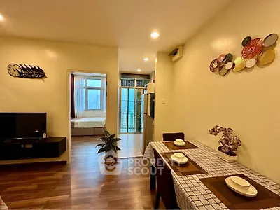 Charming open-layout living and dining area with modern decor and natural light.