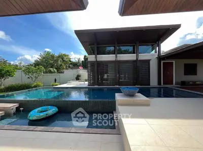 Luxurious modern villa with stunning pool and spacious outdoor area, perfect for relaxation and entertainment.