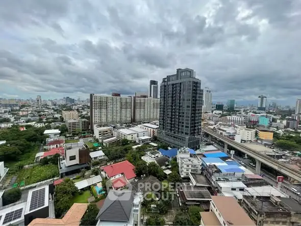 Stunning cityscape view with modern high-rise buildings and lush greenery, perfect for urban living.