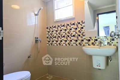 Modern bathroom with stylish tiles and sleek fixtures