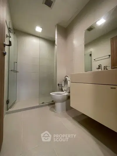 Modern bathroom with sleek design and glass shower enclosure