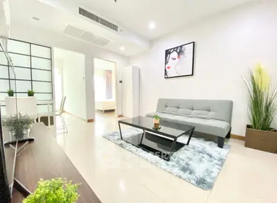 Modern living room with sleek furniture and stylish decor in a bright apartment.