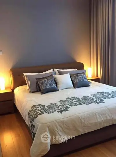 Cozy bedroom with elegant decor and soft lighting, perfect for relaxation.