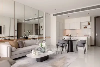 Luxurious modern living room with open kitchen, elegant decor, and stylish furniture in a contemporary apartment.