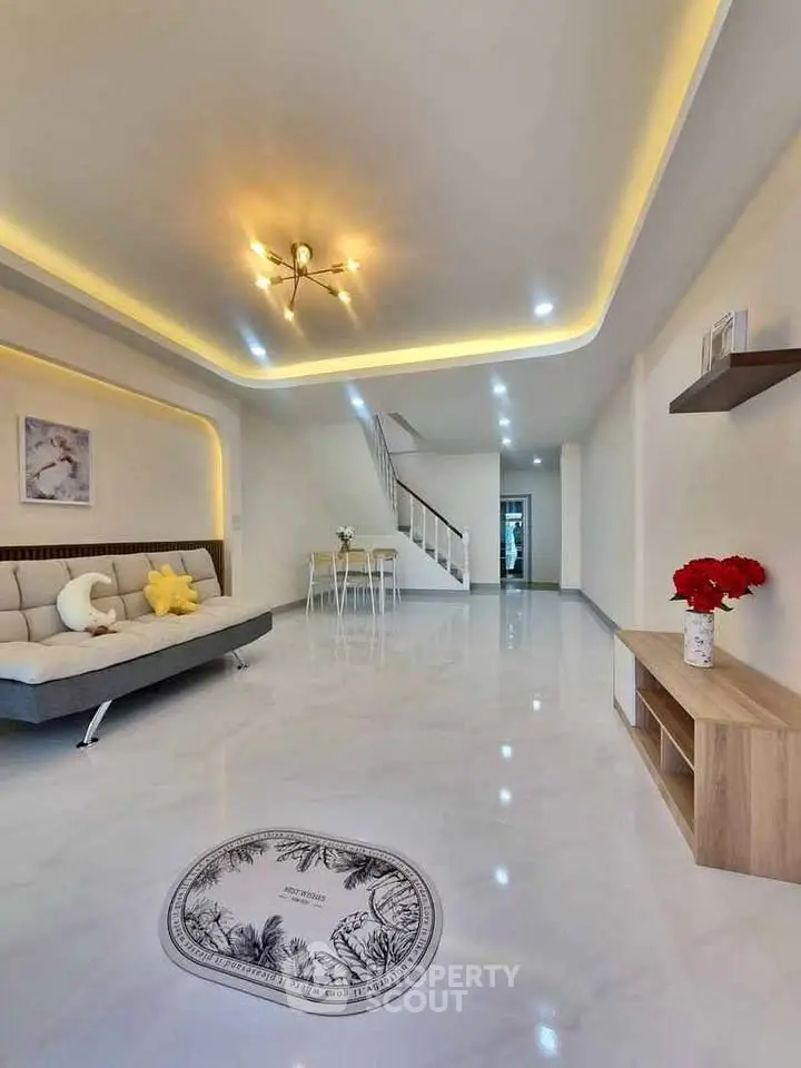 Spacious modern living room with elegant lighting and sleek design