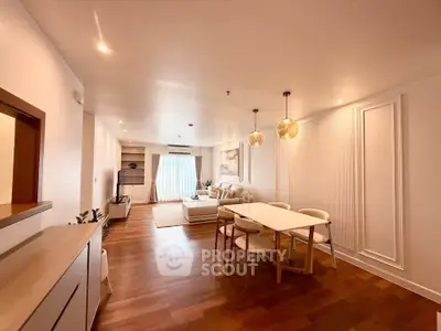 Spacious modern living room with elegant dining area and natural light