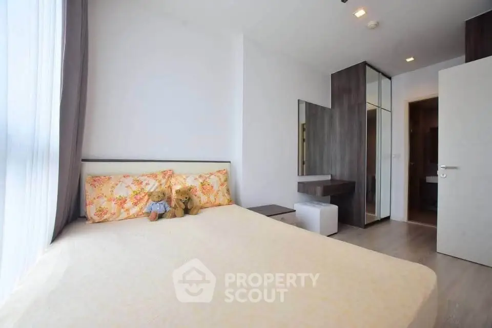 Bright and cozy bedroom with modern decor and ample natural light