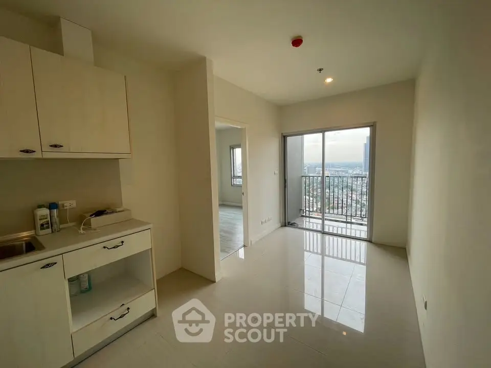 Modern apartment interior with open layout and balcony view
