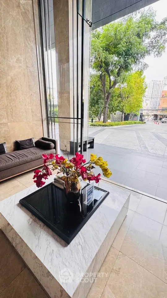 Luxurious building entrance with elegant decor and city view