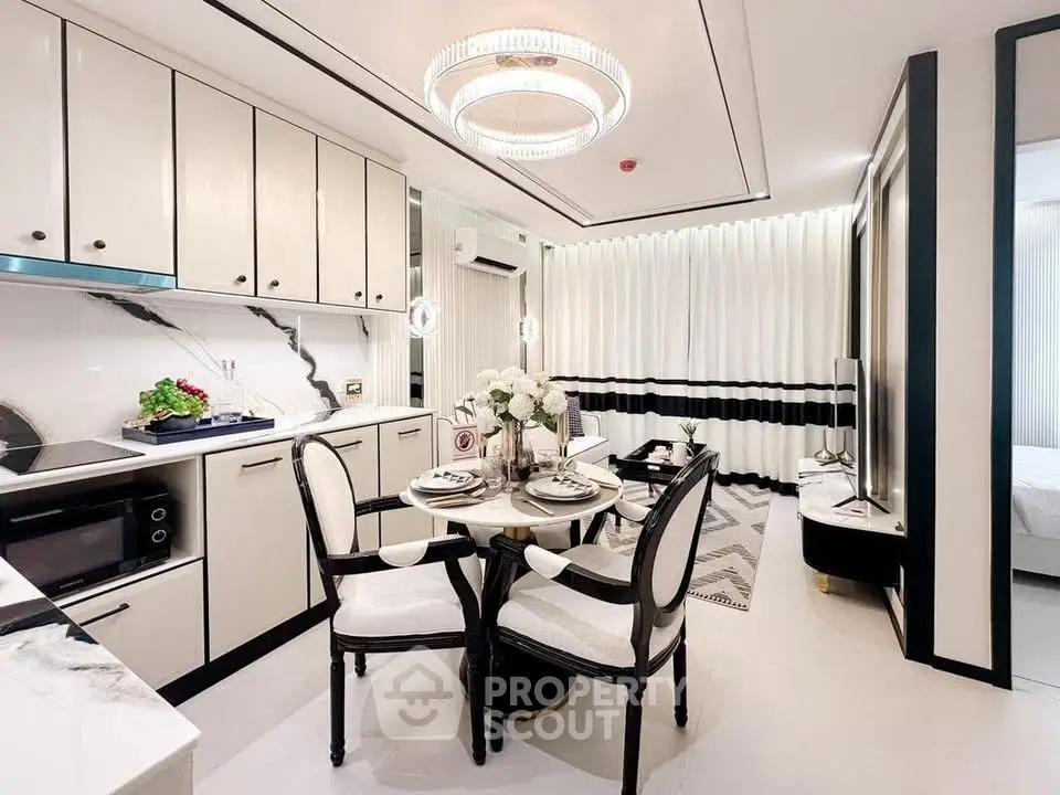 Luxurious modern kitchen and dining area with elegant decor and high-end appliances.