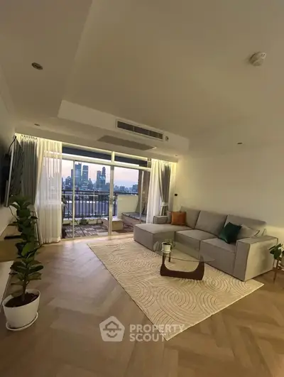 Modern living room with city view and spacious balcony access