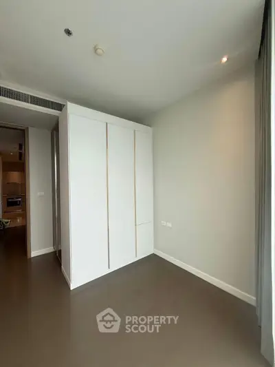 Spacious bedroom with built-in wardrobe and modern design