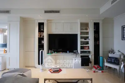 Spacious living room with modern entertainment center and stylish decor