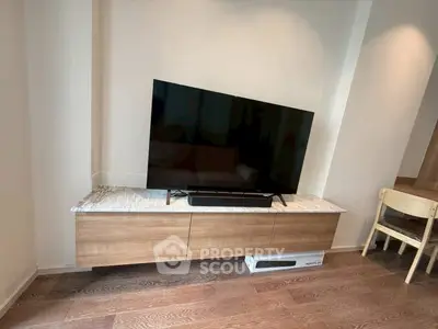 Modern living room with sleek TV stand and hardwood floors