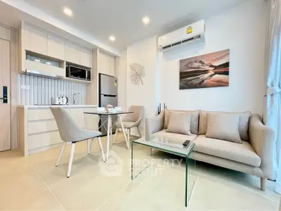 Modern living room with stylish furniture and open kitchen layout