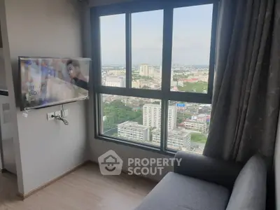Modern high-rise apartment with stunning city view and wall-mounted TV