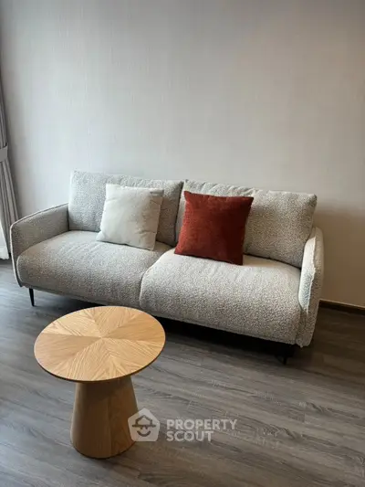 Modern living room with stylish sofa and wooden coffee table