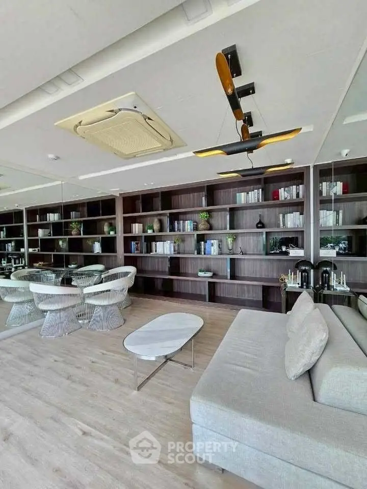 Luxurious living room with modern decor and built-in bookshelves