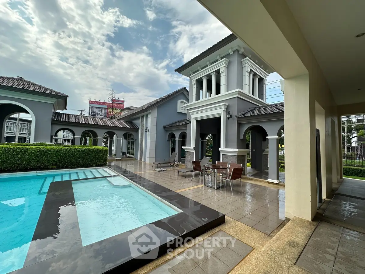 Luxurious villa with private pool and elegant architecture under a clear sky.