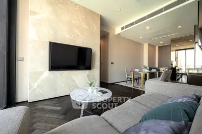 Luxurious modern living room with elegant decor and open dining area