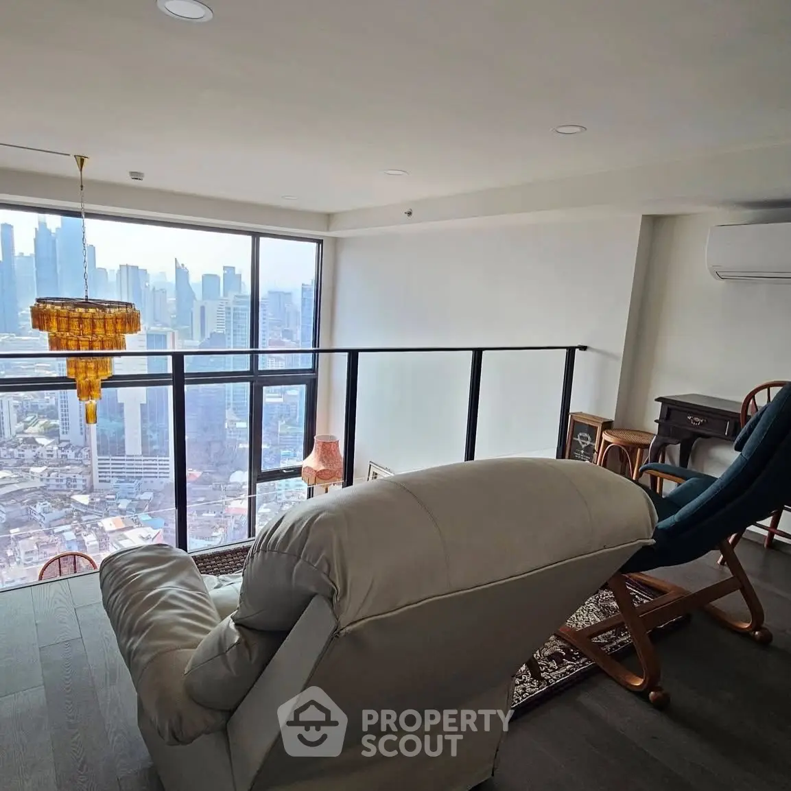 Luxurious high-rise living room with stunning city view and elegant furnishings.