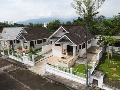 Charming suburban house with fenced yard and mountain views, perfect for family living.