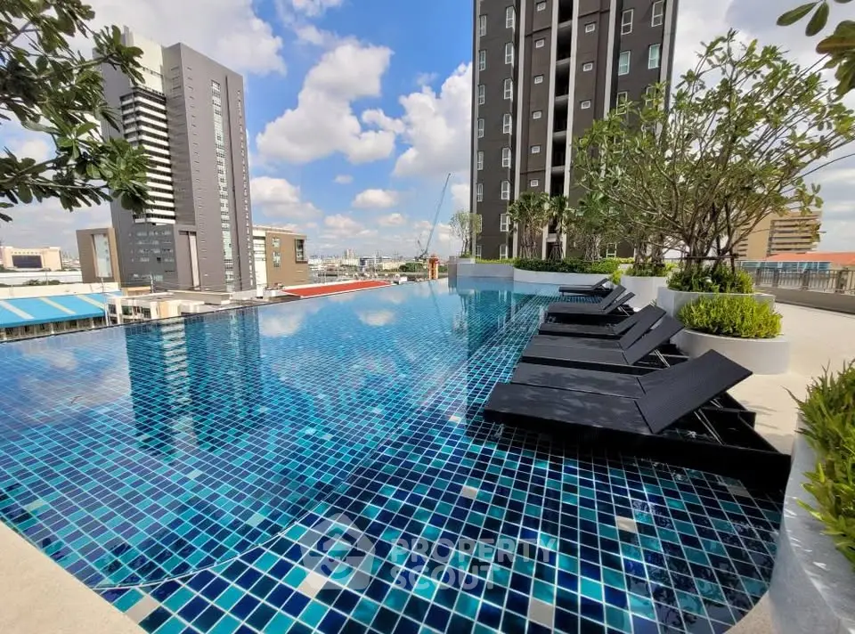Luxurious rooftop infinity pool with stunning city views and modern lounge chairs.