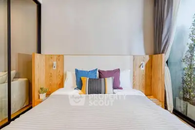 Modern bedroom with stylish decor and large window view