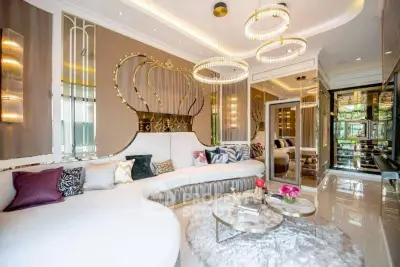 Luxurious living room with elegant decor and plush seating in a modern apartment.