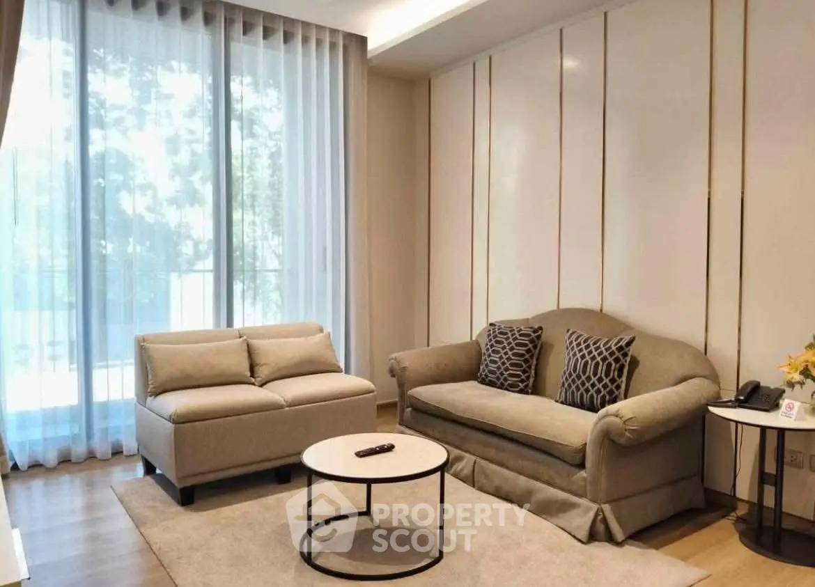 Elegant living room with modern furniture and large window view