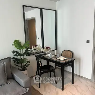 Chic modern dining area with elegant decor and cozy seating in a stylish apartment.