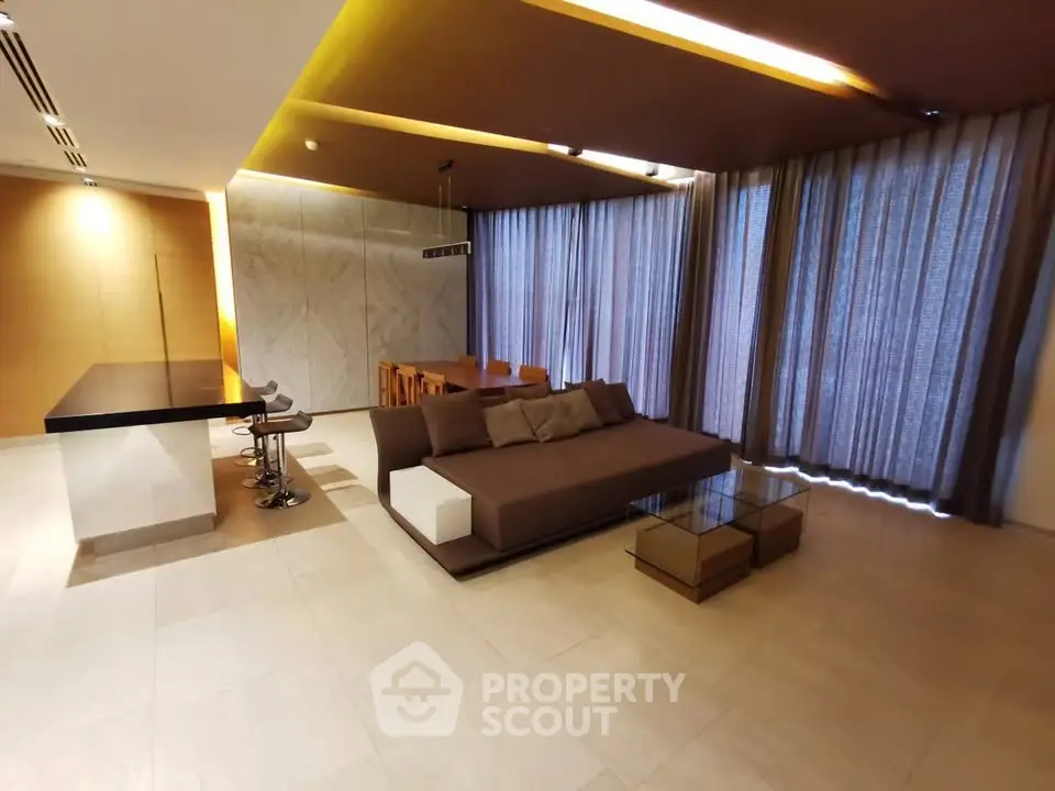 Luxurious modern living room with elegant decor and ample natural light