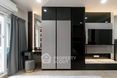 Modern bedroom with sleek wardrobe and vanity in a stylish apartment