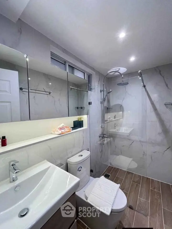 Modern bathroom with sleek fixtures and elegant marble tiles