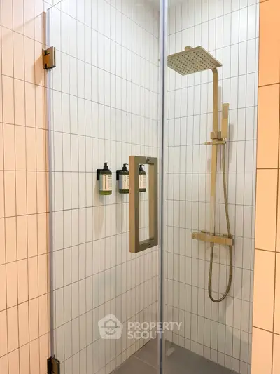 Modern bathroom shower with sleek glass door and rainfall showerhead