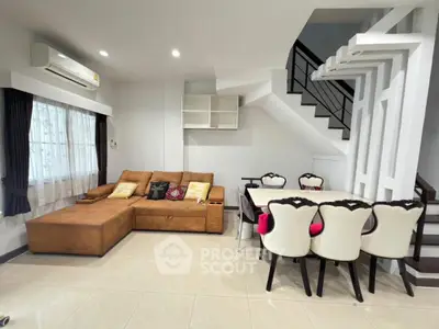 Spacious living room with modern furniture and elegant dining area