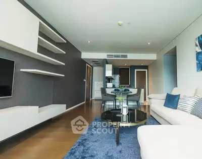 Spacious modern living room with open kitchen and stylish decor