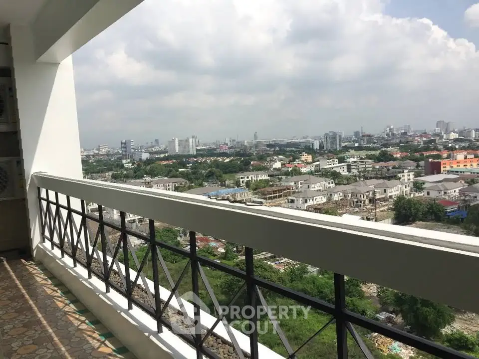 Stunning cityscape view from a spacious balcony, perfect for relaxation and enjoying urban living.