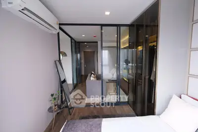 Modern bedroom with glass partition and stylish decor in luxury apartment