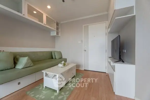 Modern living room with sleek furniture and wall-mounted TV