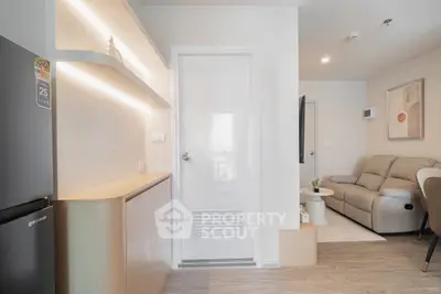 Modern living room with sleek design and cozy seating area