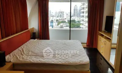 Spacious bedroom with city view in modern apartment