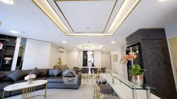 Luxurious modern living room with elegant decor and spacious seating area.