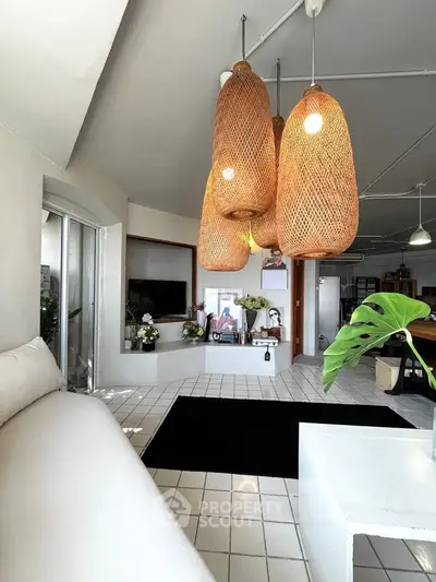Stylish living room with unique wicker pendant lights and modern decor