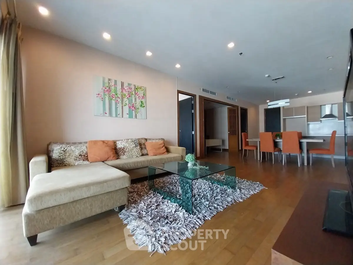 Spacious living room with modern decor and open layout in luxury apartment