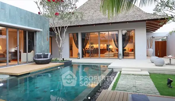 Luxurious modern villa with private pool and elegant outdoor seating area, perfect for relaxation and entertainment.