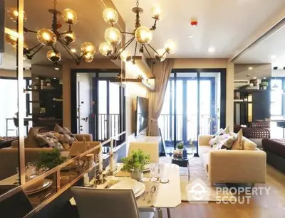 Chic and modern living room with stylish chandelier lighting, plush seating, and elegant decor, perfect for urban living.