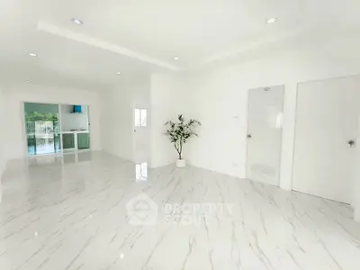 Spacious modern living room with marble flooring and elegant decor