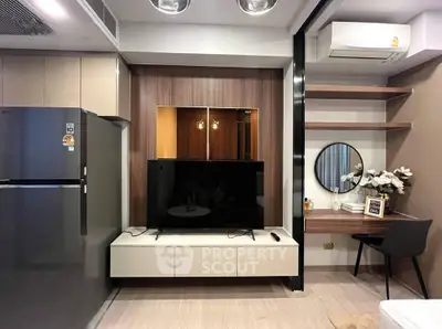 Modern living room with sleek TV setup and stylish workspace