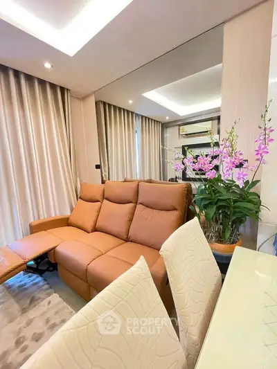 Luxurious living room with plush sofa and elegant decor in modern apartment.